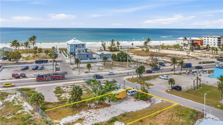 Aerial view of property and surrounding area with expansive coastline and property boundaries highlighted