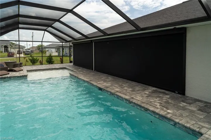 Hurricane motorized screens on back of home.