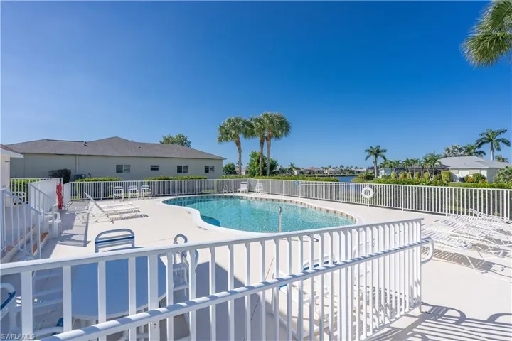 View of community pool with a patio area
