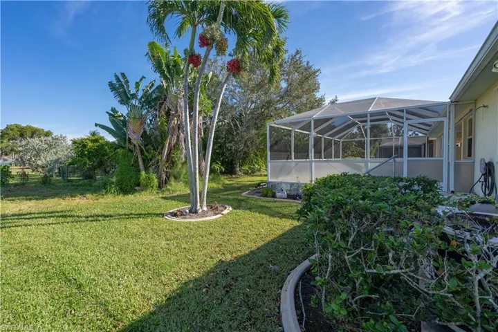 View of yard featuring a lanai