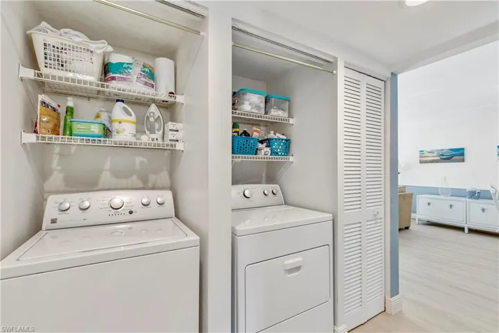 The hallway leads from the living area through to the guest bedroom. W/D (2017)