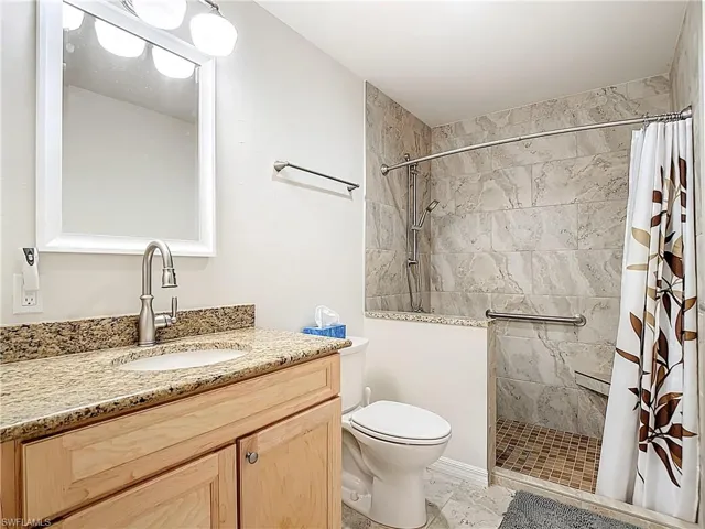 3rd Full bath with a shower stall and vanity
