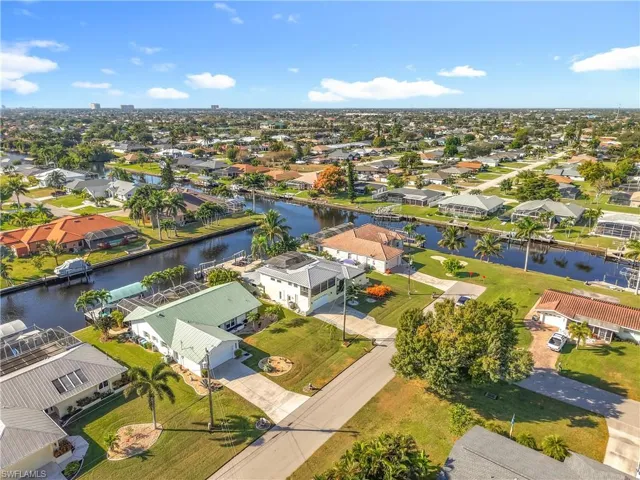 Aerial view of residential area with a large body of water
