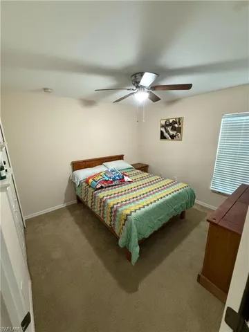 Bedroom featuring carpet floors and a ceiling fan