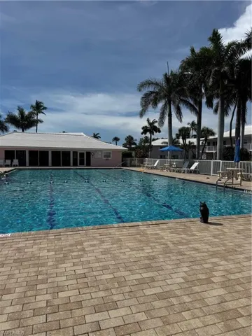 Community pool with a patio area