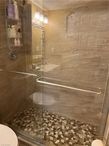 Full bath featuring a stall shower