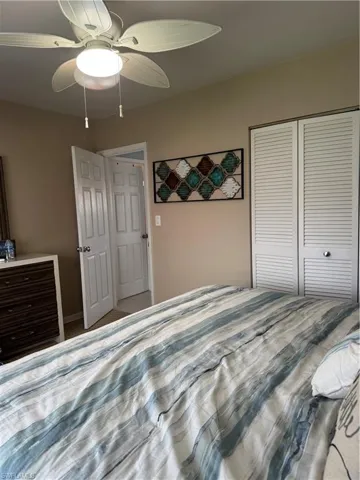 Bedroom with a closet and a ceiling fan