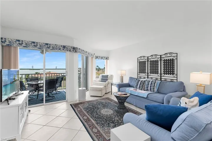 Living area featuring light tile patterned floors