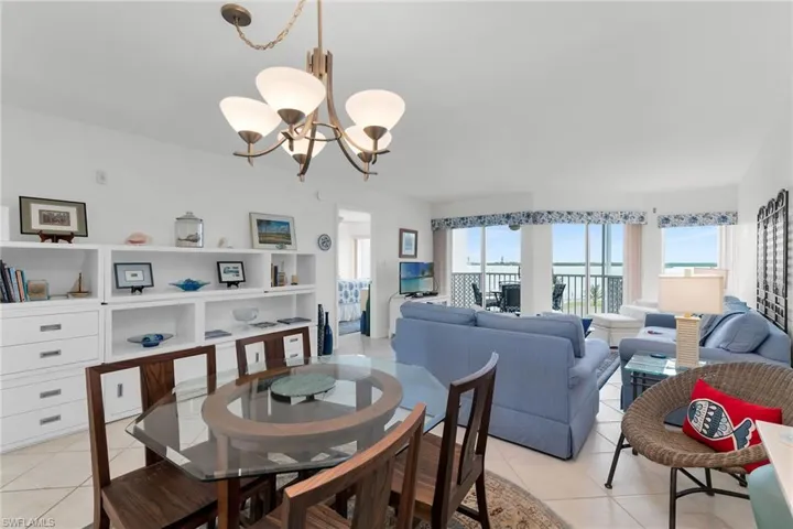 Dining area featuring a chandelier and light tile patterned flooring