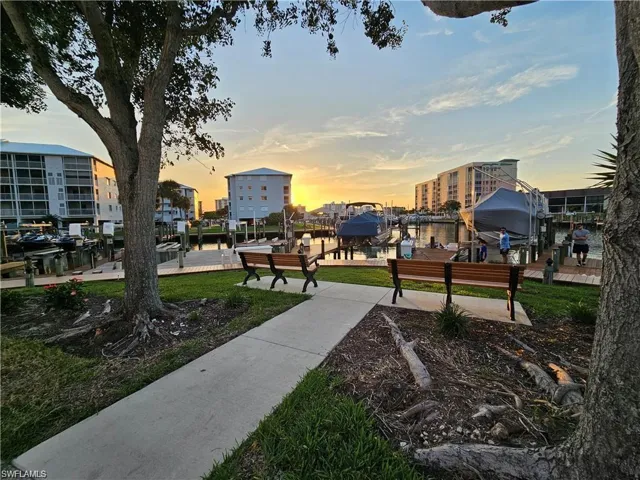 View of community with a water view and a dock