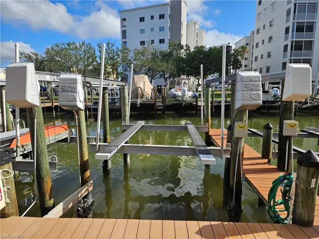 Dock area featuring a water view