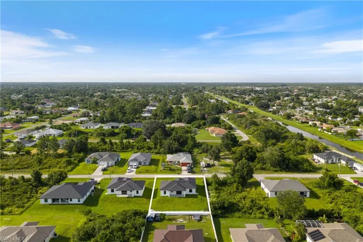 Aerial perspective of suburban area with property boundaries highlighted