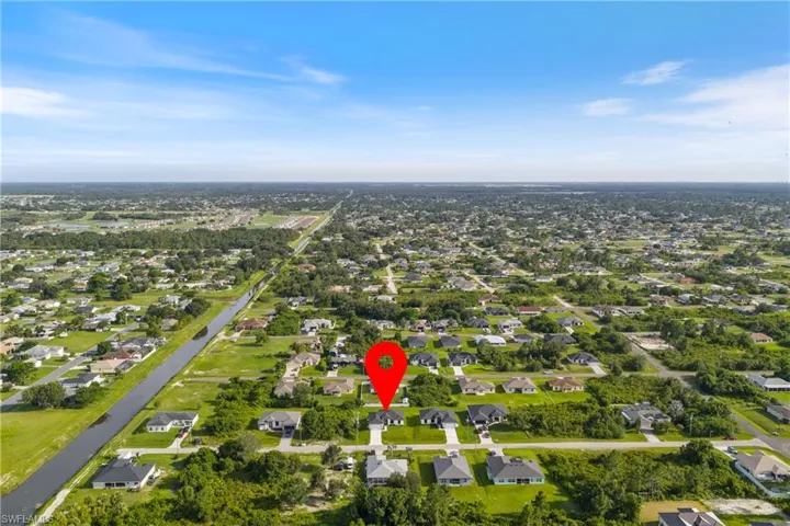 Aerial overview of property's location featuring nearby suburban area
