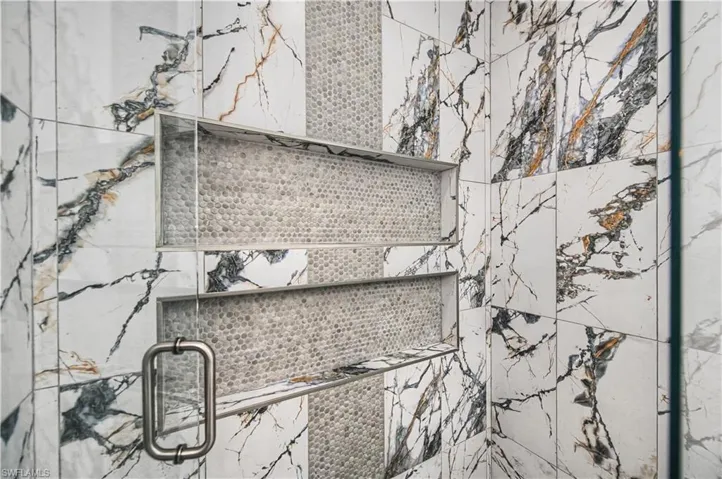 Bathroom view of a marble finish shower