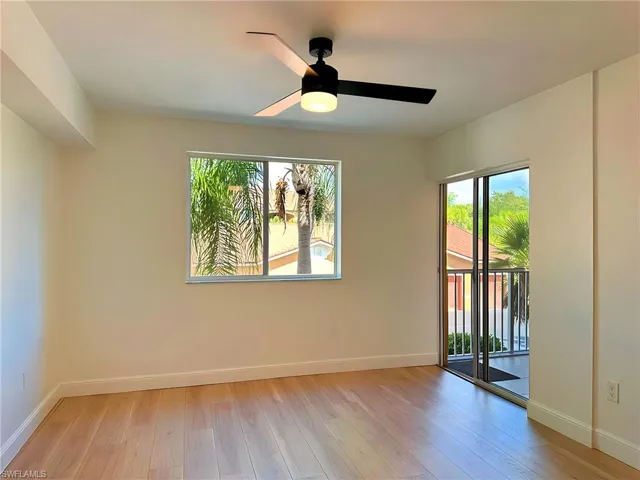 Empty room with light wood-type flooring and ceiling fan