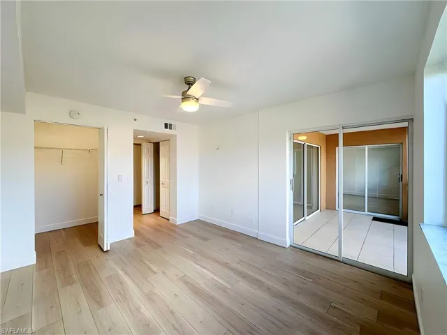 Unfurnished bedroom featuring light hardwood / wood-style floors and ceiling fan