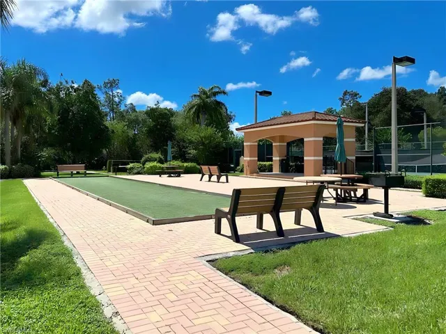 View of property's community featuring a lawn