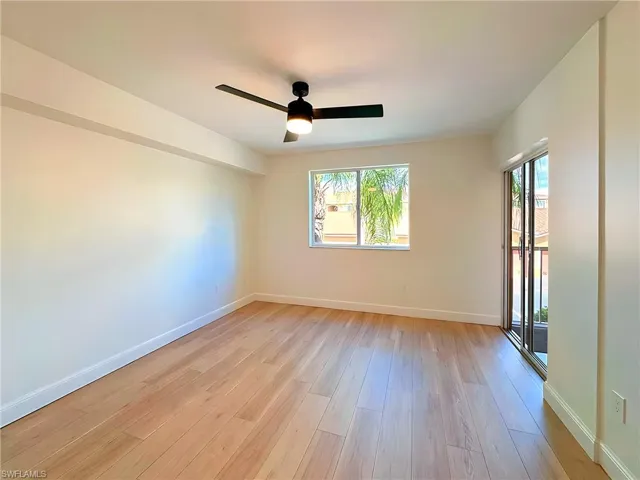 Spare room with light hardwood / wood-style flooring and ceiling fan