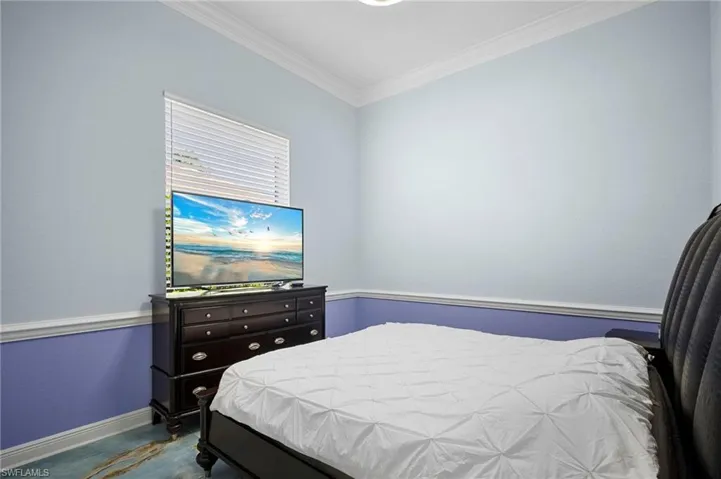 Bedroom featuring baseboards and ornamental molding