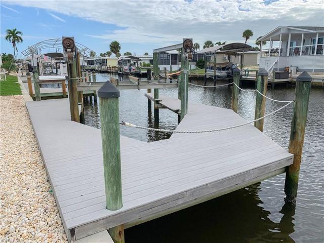 Beautiful composite, captain's walk dock with lift and fish cleaning station