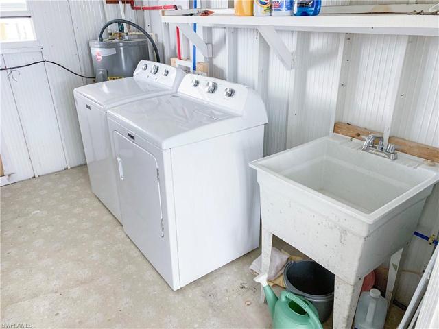 Storage shed  and laundry off carport