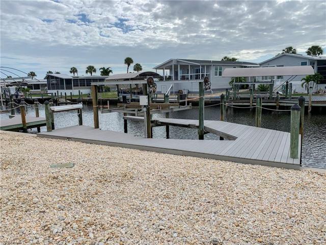 Beautiful composite, captain's walk dock with lift and fish cleaning station