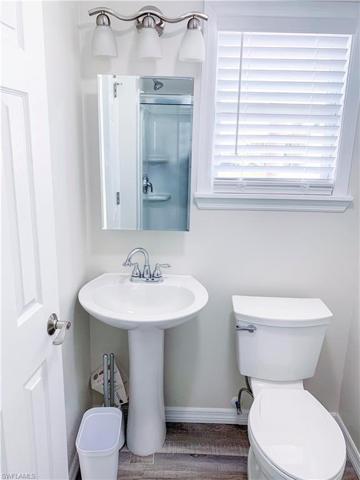 Primary bedroom with ensuite bath and gentleman's sink