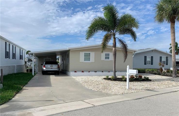 Front of home with parking for 3 vehicles