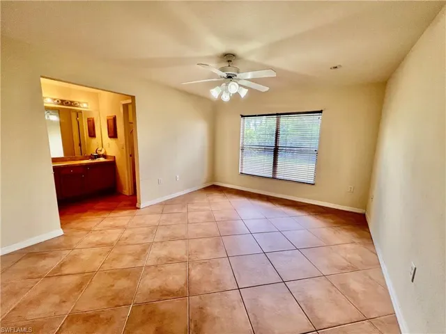 Primary bedroom with ensuite bathroom and walk in closet.