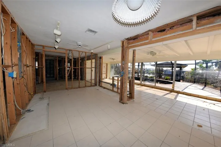 Large Florida Room with sliders to pool and dock