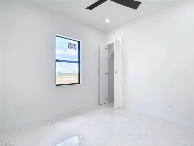 Spare room featuring ceiling fan
