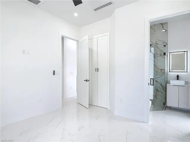 Unfurnished bedroom featuring ceiling fan