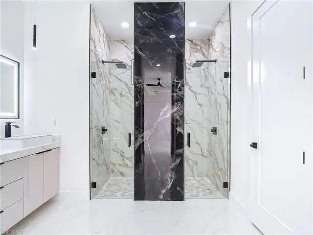 Bathroom featuring vanity and walk in shower