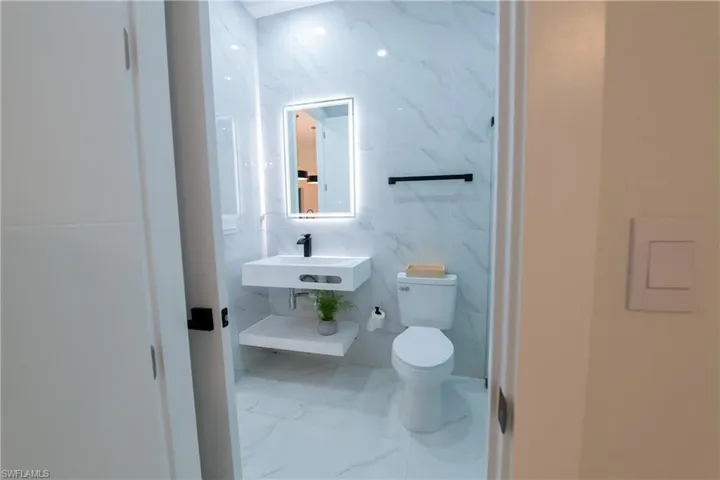 Bathroom with sink and toilet