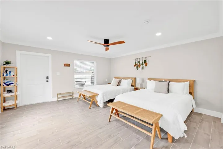 Bedroom featuring recessed lighting, ceiling fan, wood finish floors, and crown molding