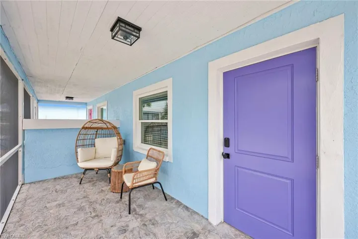 Doorway to property with stucco siding