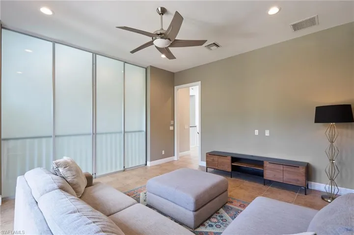 Loft with smoked pocket doors for privacy