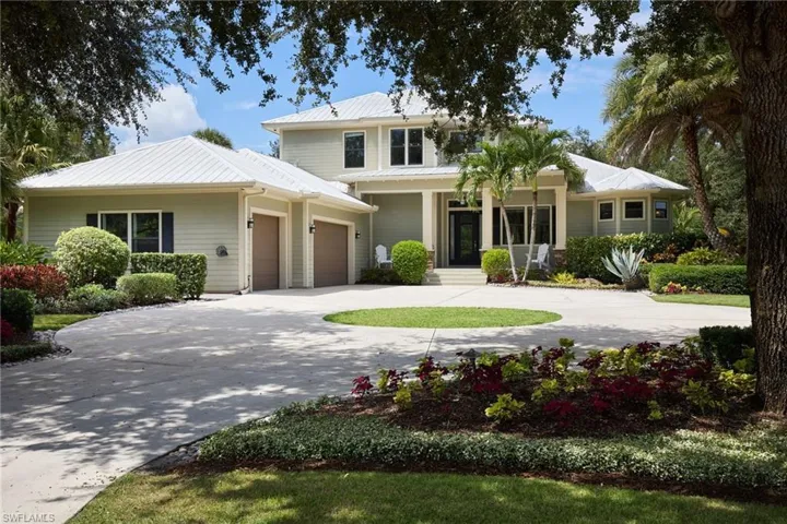 View of front of home featuring the three car garage