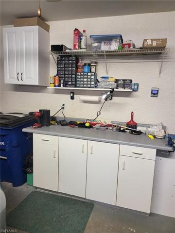 Men love their garages, this has a workbench!