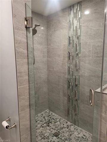 Tiled shower with Glass Door
