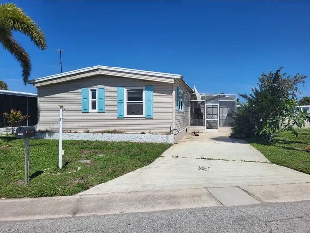 View of front of property with a front lawn