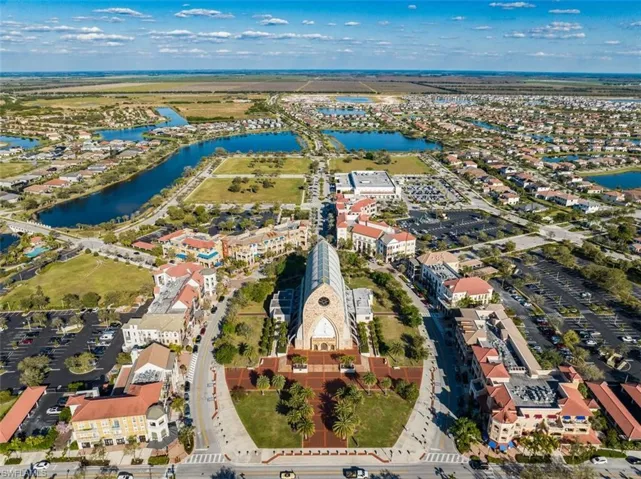 Drone / aerial view of town center and Ave Maria Church