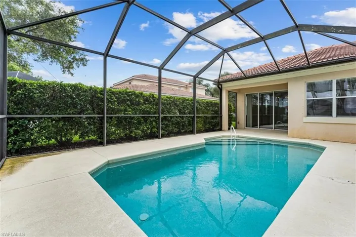 Swimming pool with a patio area