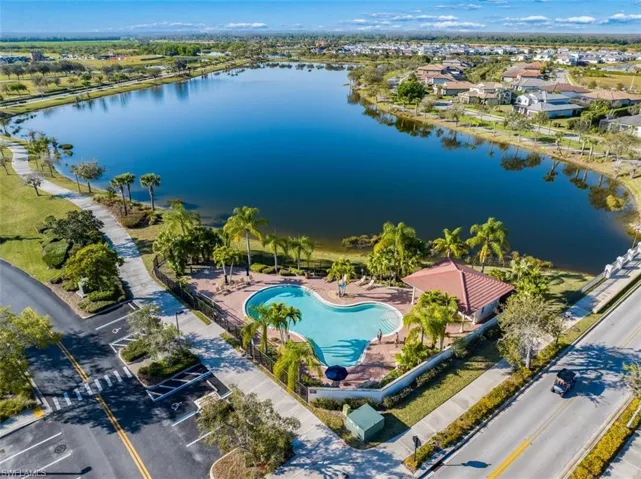 Drone / aerial view of a large body of water] and a pool area
