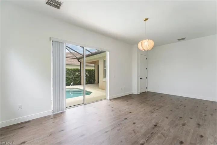 Empty room featuring wood finished floors