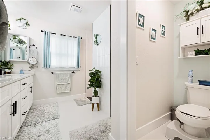 Bathroom featuring vanity and walk in shower