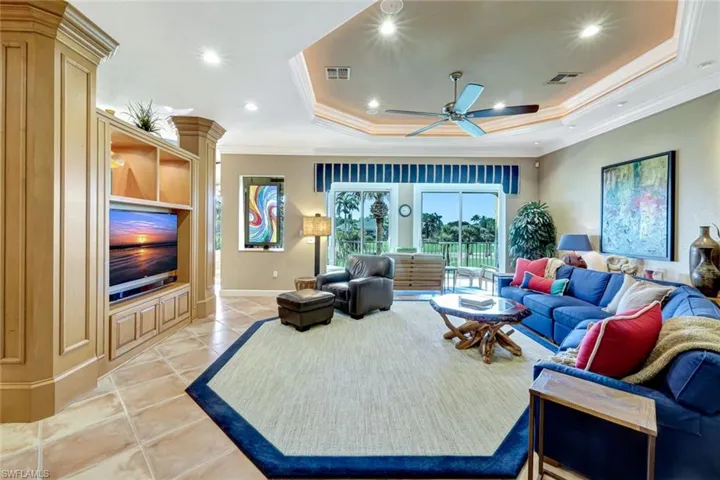 Living room featuring ceiling fan, visible vents, recessed lighting, and a raised Octagonal ceiling