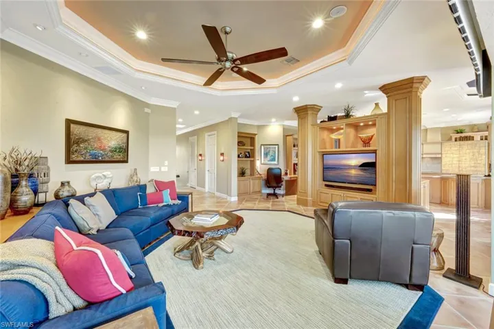 Living area featuring decorative columns