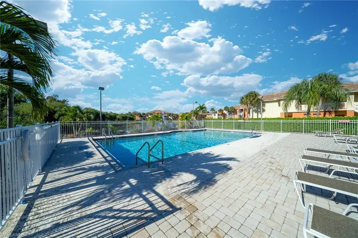 Community pool with a patio area
