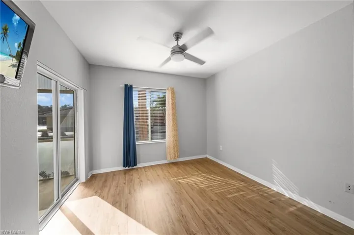 Spare room featuring light wood finished floors and a ceiling fan